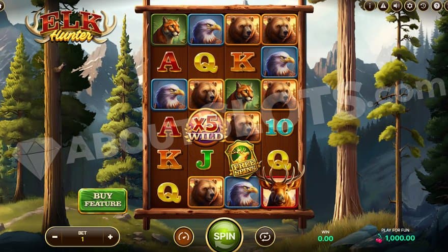 A casino slot in a forest with tall mountains in the back.