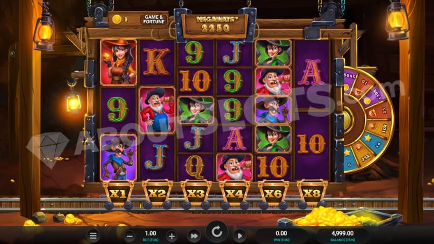 Base game with a mine in the background, lit up by lanterns.