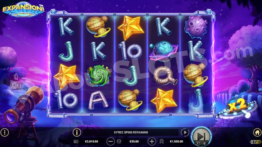 A countryside landscape at nighttime with five reels in the middle.