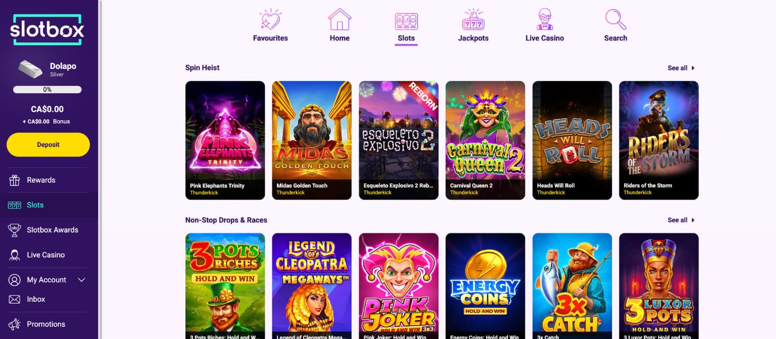 Slotbox Casino slots lobby showing the ‘Slots’ section selected, with Thunderkick slot titles such as Pink Elephants Trinity, Midas Golden Touch, Esqueleto Explosivo 2, Carnival Queen 2, and Heads Will Roll displayed in a grid, alongside category navigation for favourites, jackpots, live casino, and search