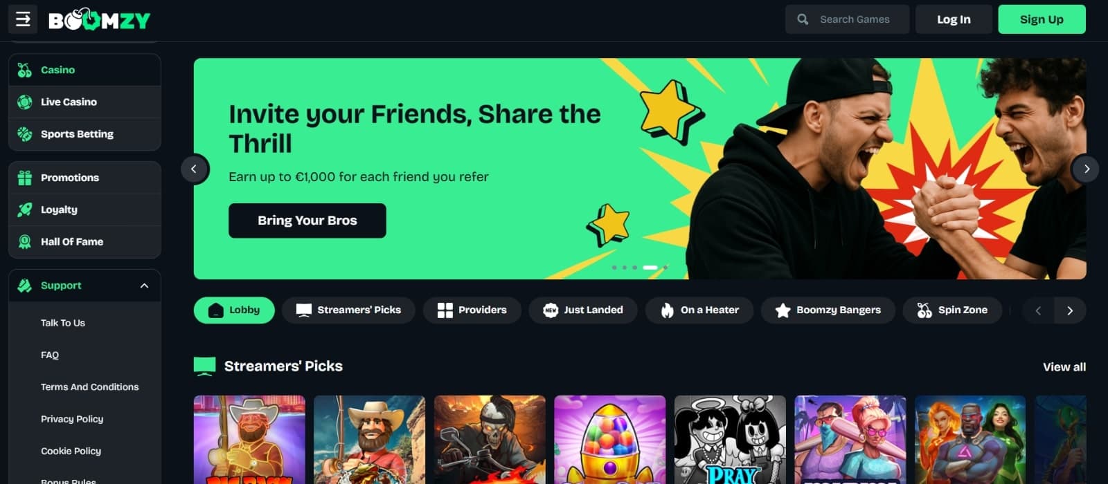 Boomzy Casino's landing page with banner of referral bonus with image of  two players celebrating above slot game categories