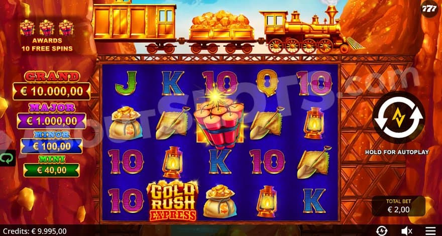 A casino grid under a train bridge between two mountains.