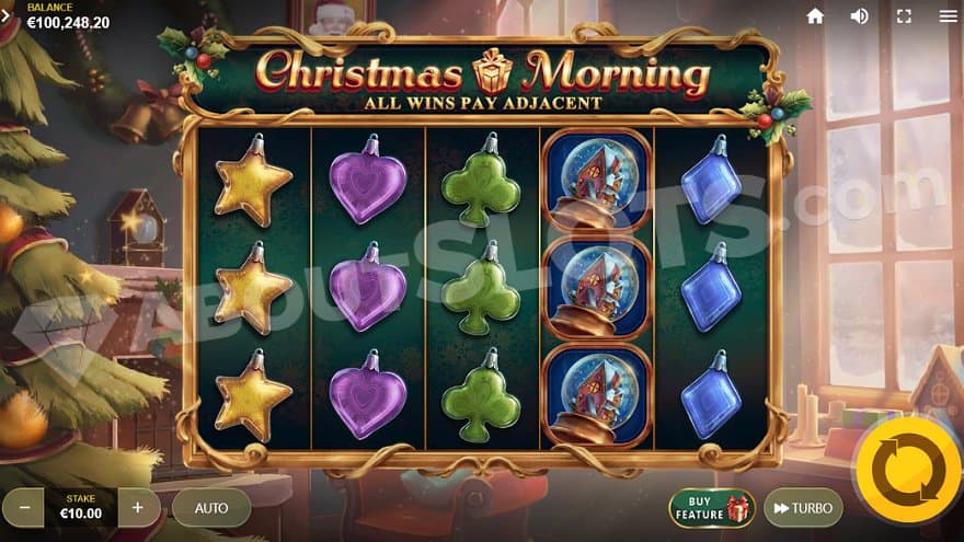 A casino slot next to a Christmas tree.