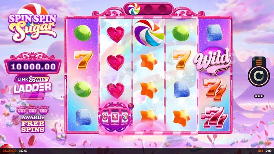 A pink landscape full of candy with reels full of candy symbols.