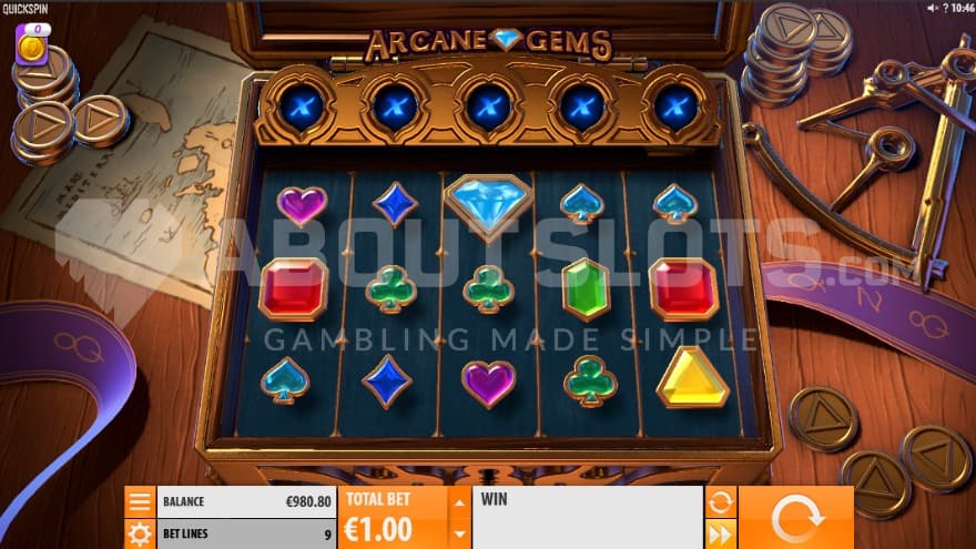 The base game being played on a locked box, sitting on top of a table filled with coins and maps