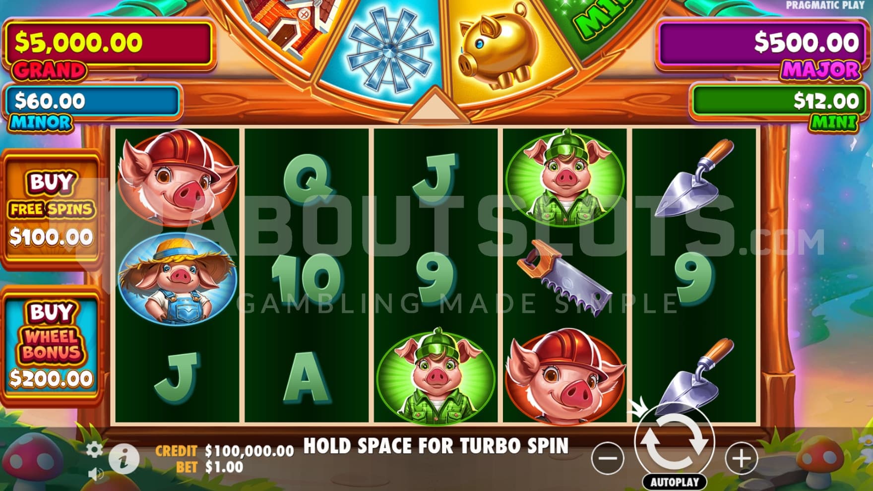 The playing grid with various jackpot signs, feature buys, and the random bonus wheel surrounding the reels