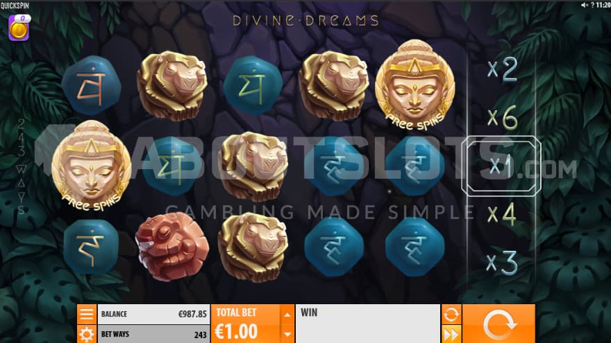 The base game playing grid within a forest with buddha symbols and carved animals made out of wood symbols