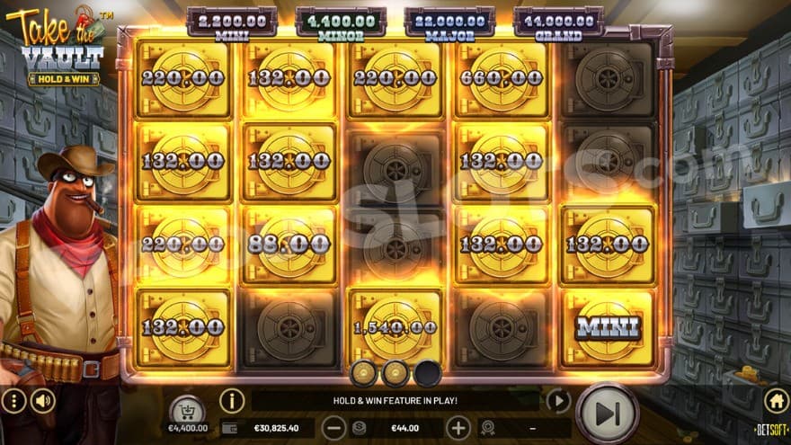 Hold and Win feature with various prize symbols on the reels.