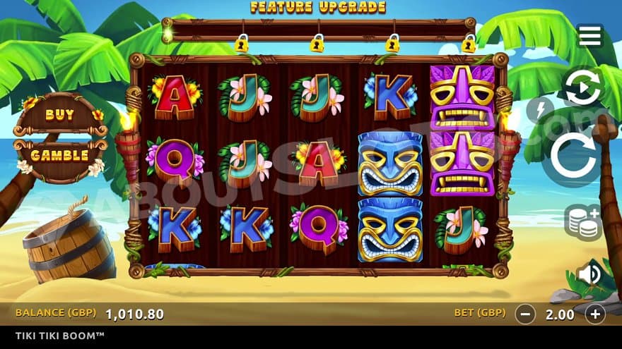 Five casino slot reels on a beach with palm trees.