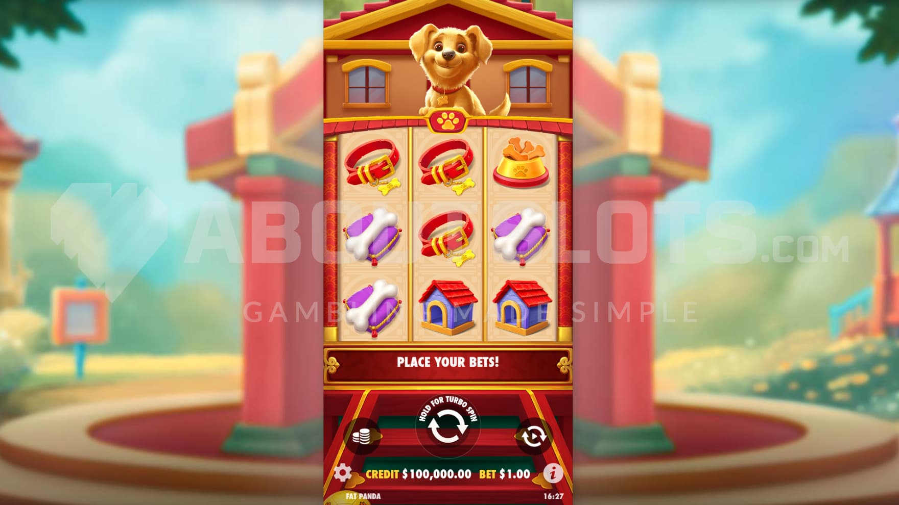 The puppy sits above the reels as you play