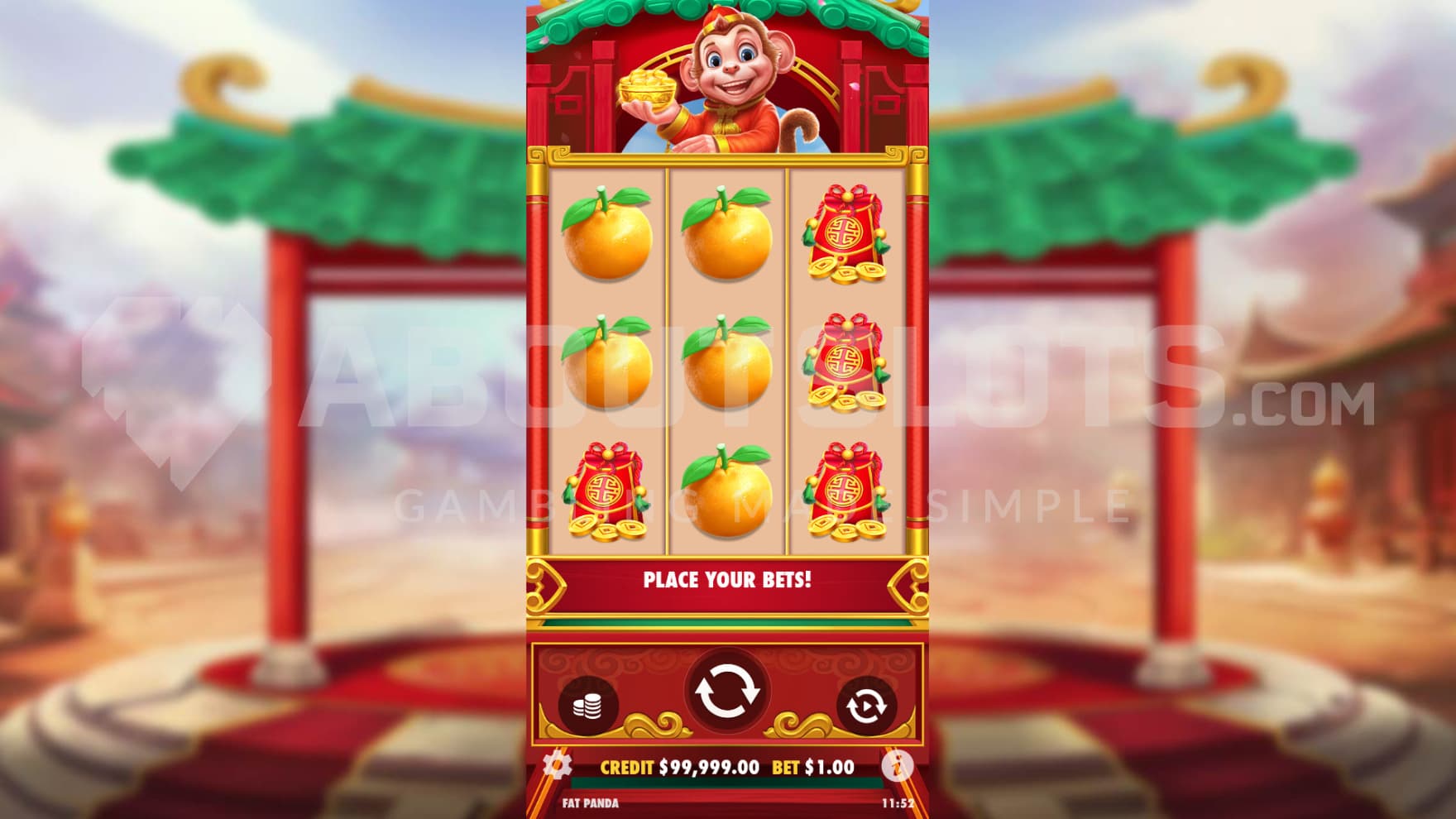 The monkey sits above the reels overlooking the spins