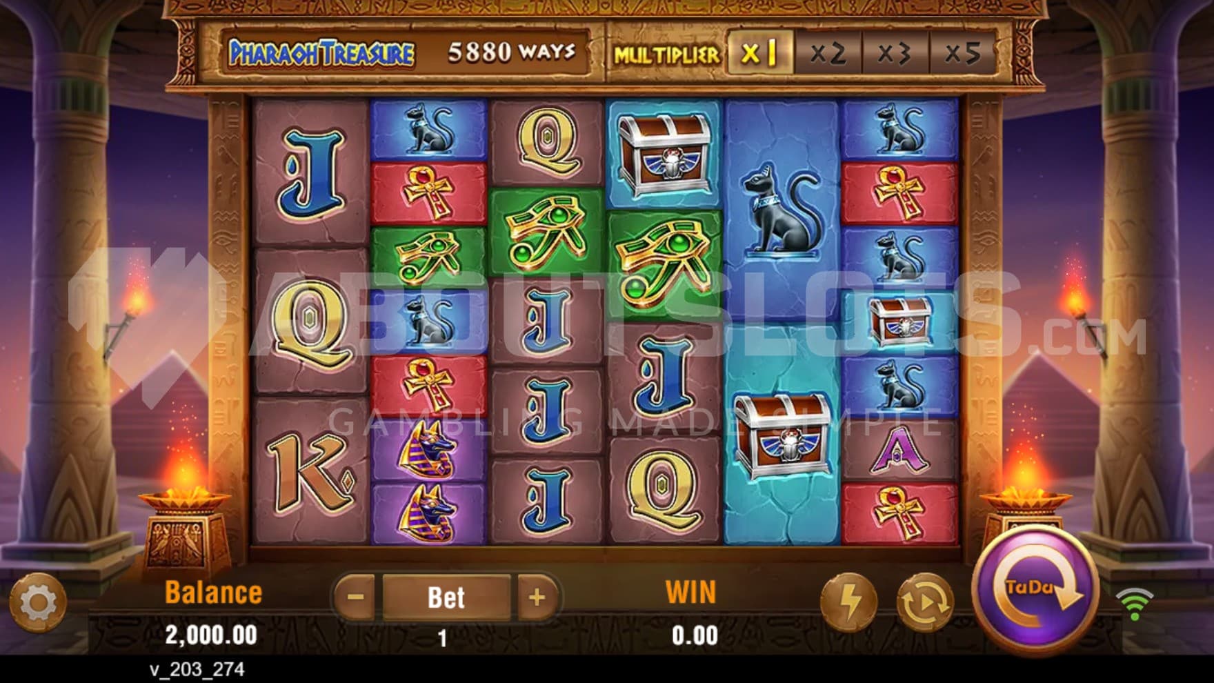 The playing grid is set at a temple with a view of the desert and pyramids in the background