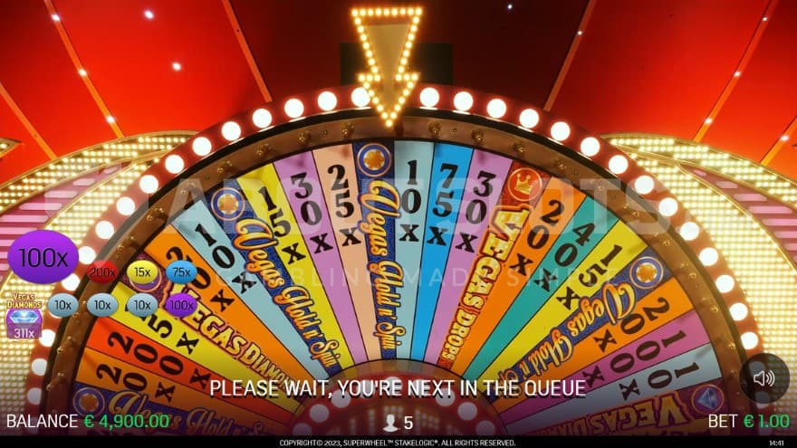 Super Wheel feature with a giant prize wheel on the screen.