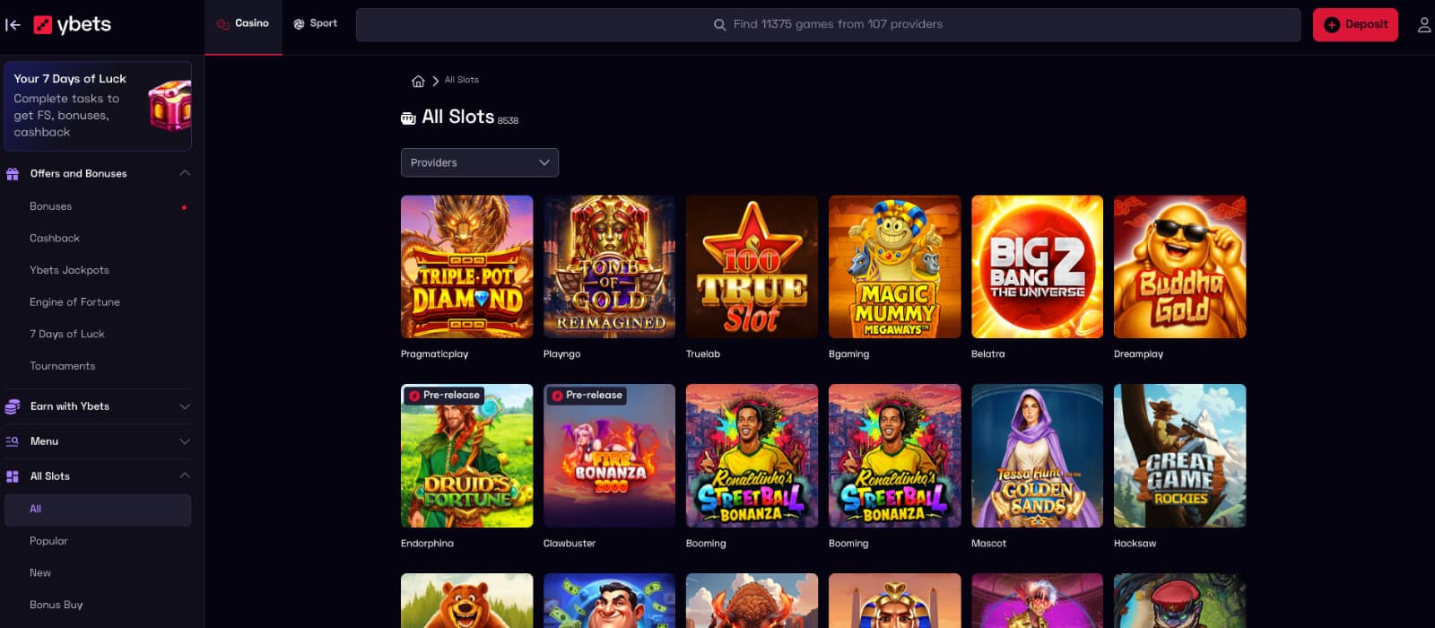 Ybets Casino games page showing the All Slots lobby, provider filter and slot titles from 107 providers.