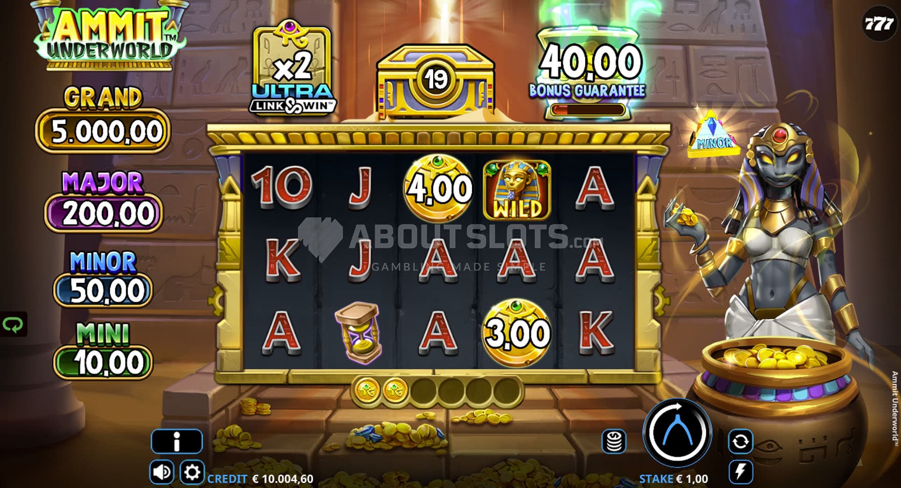 Screenshot of the base game, showing a 5x3 grid on a backdrop of an Egyptian tomb, with a goddess standing on the right.