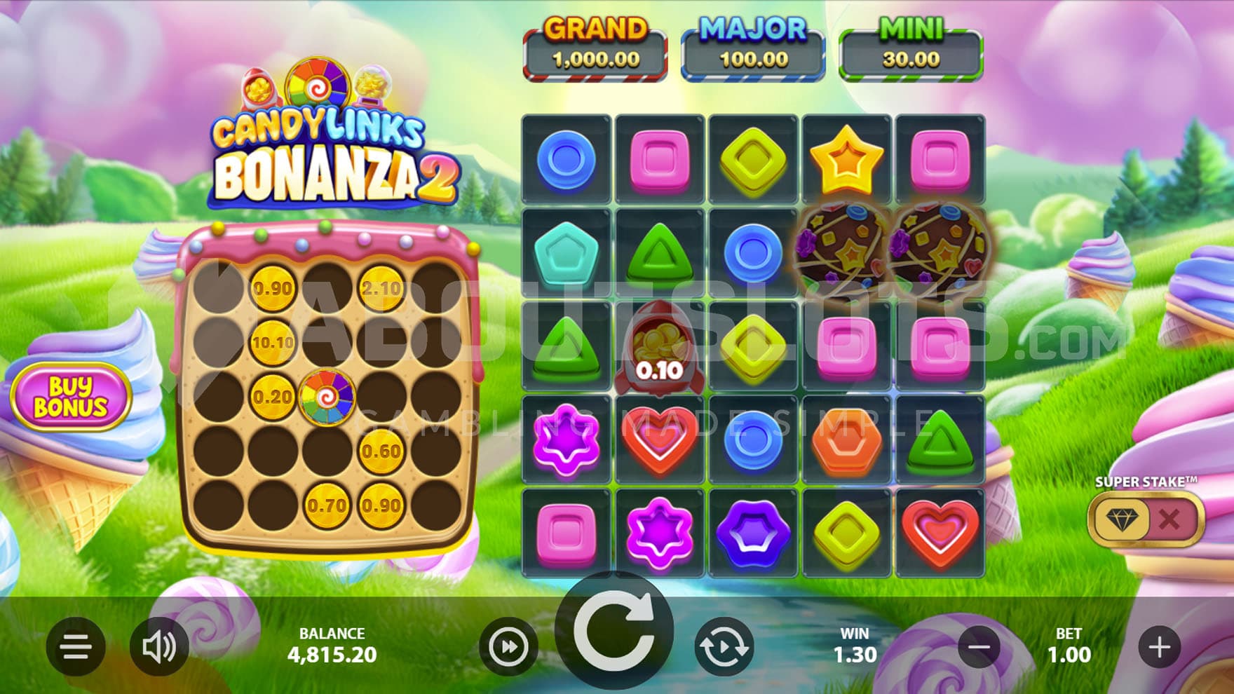 Base Game view of a dual 5x5 grid on a backdrop of a vibrant candyland.