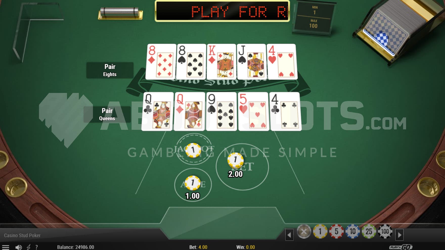 Base Game view of a green felt-lined table with various card accessories around and two poker hands dealt.