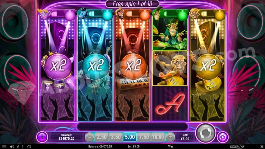 The first free spin of 10 with stacked multipliers on reels 1, 2, and 3.