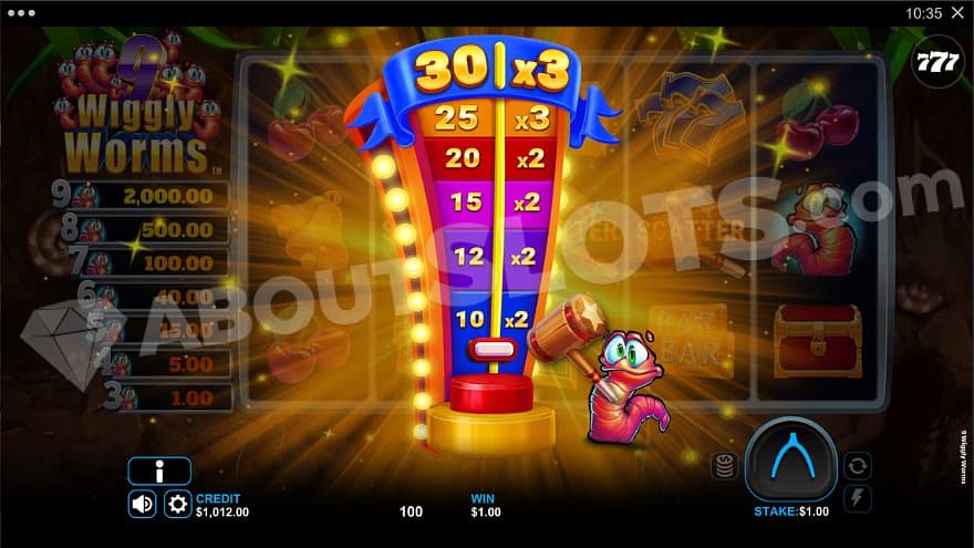 A worm holding a wooden hammer next to a strongman game.