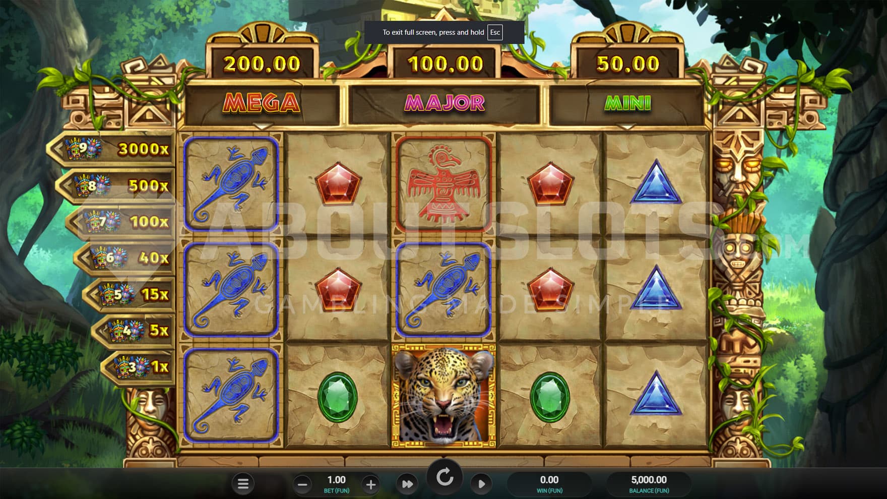 Base Game view of a 5x3 grid in an Aztec-themed frame on a backdrop of an exotic jungle.