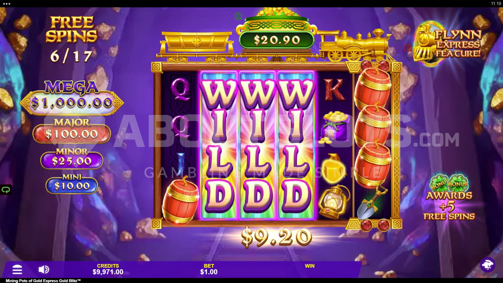 Free Spins bonus in progress, showing three Expanding Wilds on reels 2, 3, and 4.