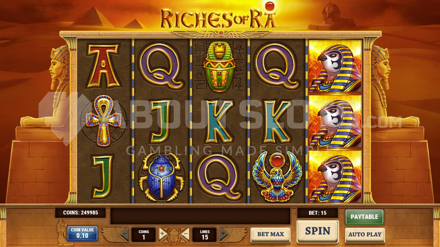 Base Game view of a 5x3 grid on a backdrop of a desert with pyramids in the distance.