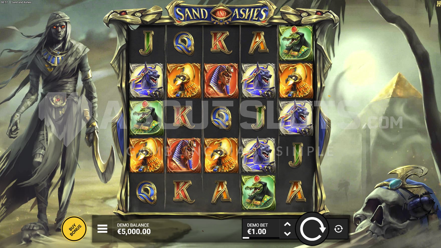 Base Game view of a 5x5 grid on a backdrop of a desert with a pyramid on the right and a mummified warrior on the left.