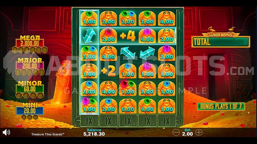 Three arrows on the 5x6 grid in the Luxor Bonus Feature.