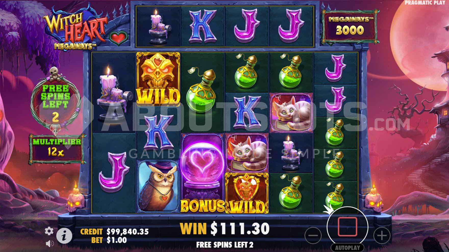 Free Spins bonus in progress with a x12 multiplier accumulated and two Witch Heart Wilds on the grid.